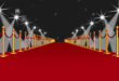 Red Carpet Event Walk with Spotlights Against Black Background